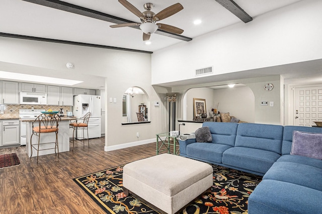 5427 Cairnleigh Dr, Houston, TX 77084 - living area with arched walkways, high vaulted ceiling, a ceiling fan, dark wood-style floors, and beam ceiling