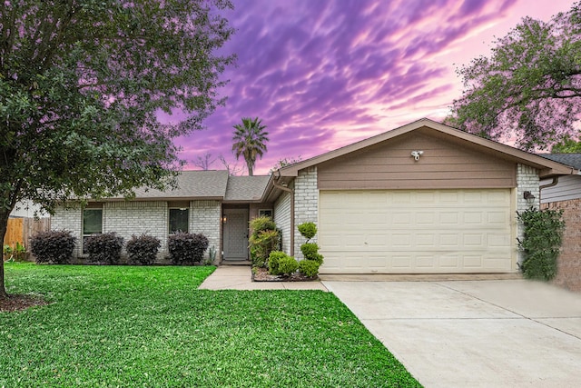 5427 Cairnleigh Dr, Houston, TX 77084 - single story home featuring driveway, a garage, brick siding, and a front lawn