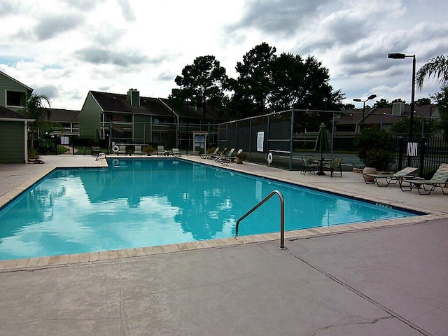 14777 Wunderlich Dr Unit 2404, Houston, TX 77069 - community pool featuring a patio area and a residential view