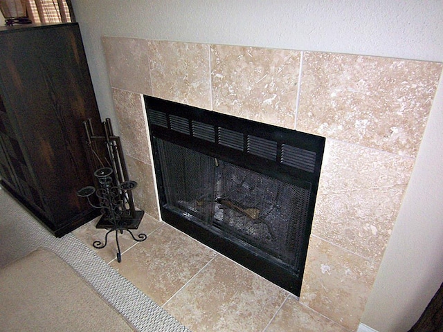 14777 Wunderlich Dr Unit 2404, Houston, TX 77069 - detailed view of a tile fireplace and a textured wall