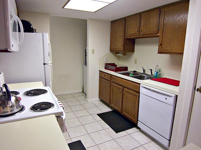 14777 Wunderlich Dr Unit 2404, Houston, TX 77069 - kitchen with white appliances, light countertops, and light tile patterned flooring