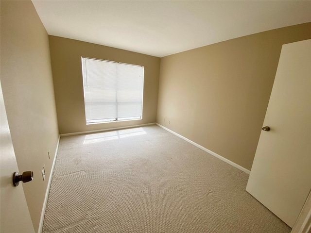 14777 Wunderlich Dr Unit 2404, Houston, TX 77069 - spare room featuring baseboards and light colored carpet