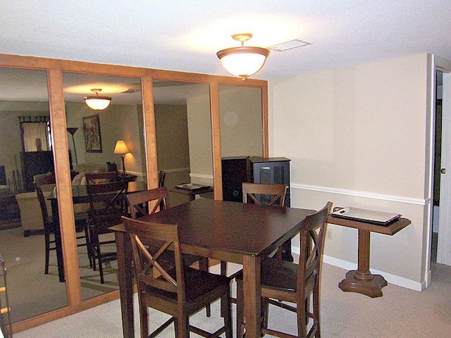 14777 Wunderlich Dr Unit 2404, Houston, TX 77069 - dining room featuring light colored carpet and baseboards