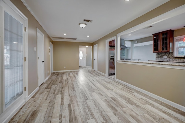 5502 Lincrest Ln, Houston, TX 77056 - unfurnished living room featuring light wood finished floors, recessed lighting, and crown molding