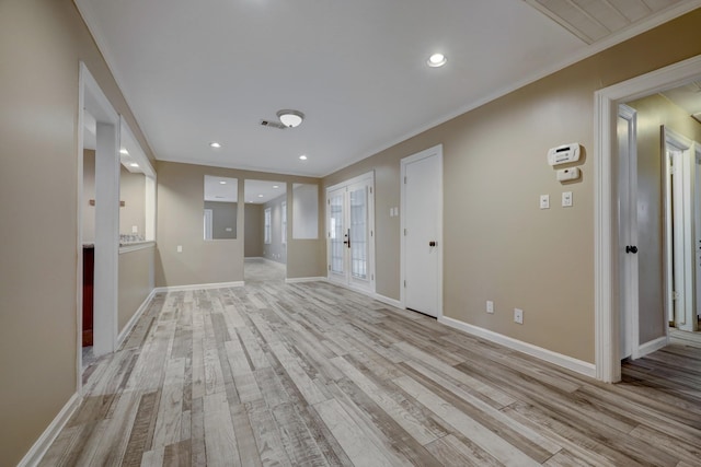 5502 Lincrest Ln, Houston, TX 77056 - unfurnished living room featuring ornamental molding, light wood-style flooring, and recessed lighting