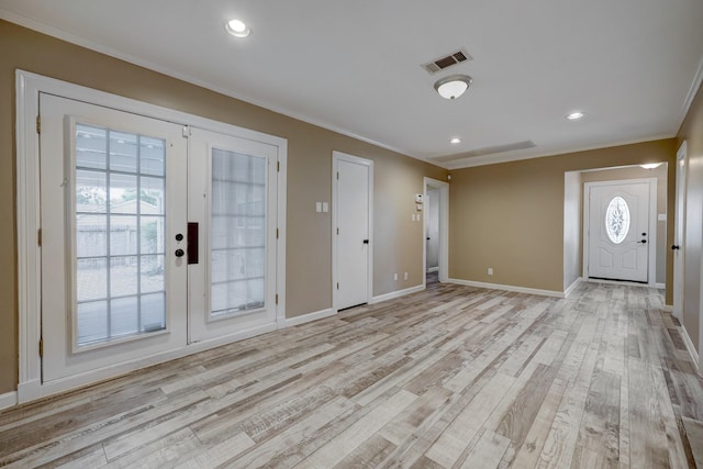 5502 Lincrest Ln, Houston, TX 77056 - entryway with french doors, ornamental molding, light wood-type flooring, and recessed lighting