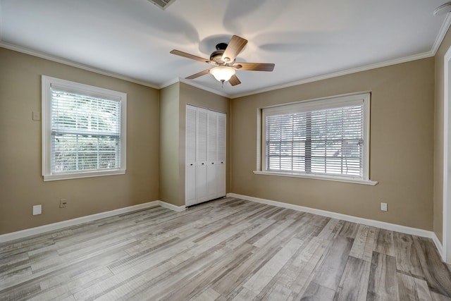 5502 Lincrest Ln, Houston, TX 77056 - unfurnished bedroom with light wood-style floors, ornamental molding, a closet, and ceiling fan