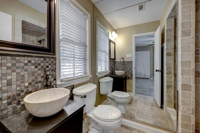 5502 Lincrest Ln, Houston, TX 77056 - bathroom featuring tile walls, vanity, tile patterned floors, and a shower
