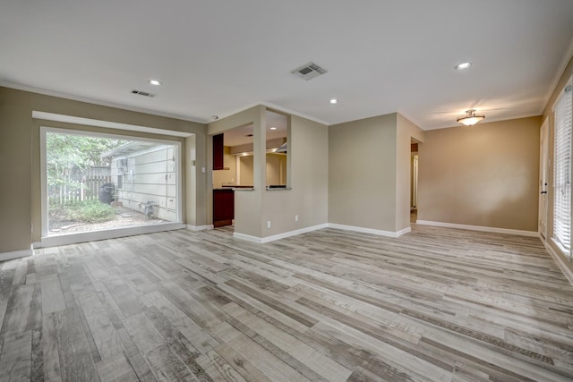 5502 Lincrest Ln, Houston, TX 77056 - unfurnished living room with light wood-style flooring, recessed lighting, and crown molding