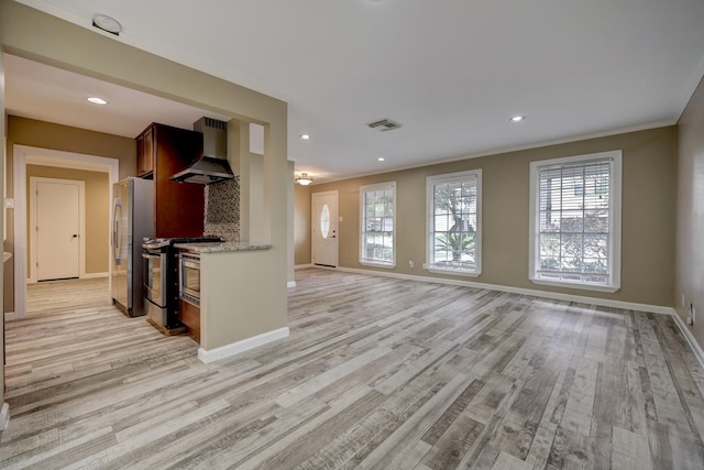 5502 Lincrest Ln, Houston, TX 77056 - kitchen with wall chimney range hood, stainless steel appliances, light wood-style floors, light stone countertops, and recessed lighting