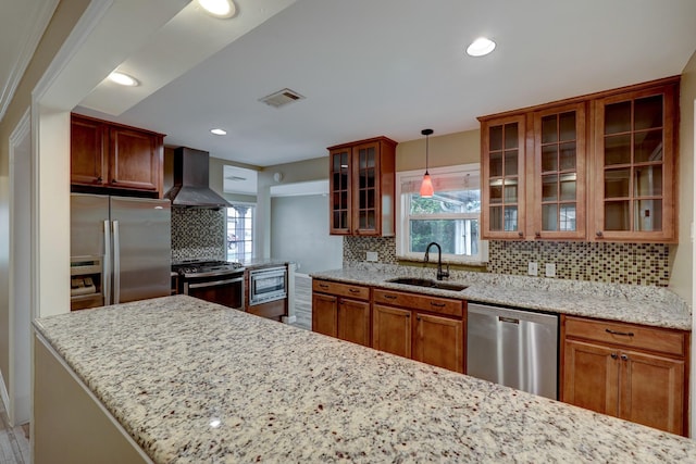 5502 Lincrest Ln, Houston, TX 77056 - kitchen featuring ventilation hood, stainless steel appliances, decorative backsplash, brown cabinetry, and light stone countertops