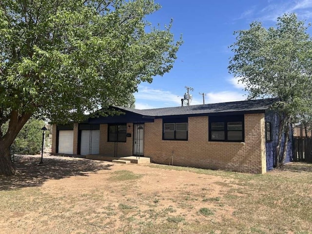 402 51st St, Lubbock, TX 79404 - single story home featuring brick siding and a garage