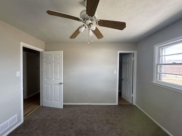 402 51st St, Lubbock, TX 79404 - unfurnished bedroom featuring a textured ceiling, carpet floors, and a ceiling fan