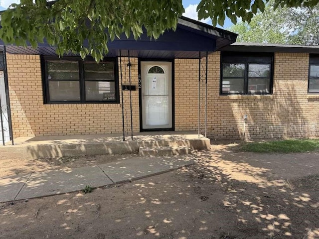402 51st St, Lubbock, TX 79404 - property entrance featuring brick siding