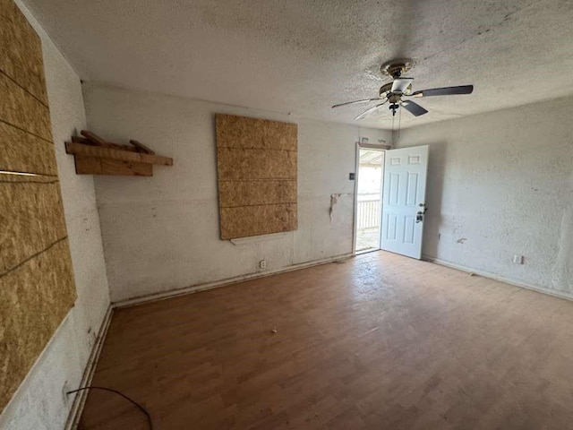 506 E Ursuline St, Lubbock, TX 79403 - empty room featuring wood finished floors, a ceiling fan, and a textured ceiling
