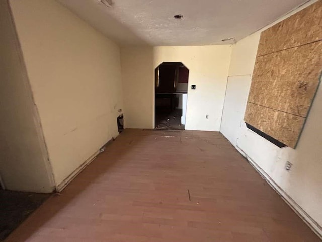 506 E Ursuline St, Lubbock, TX 79403 - hallway featuring arched walkways and wood finished floors