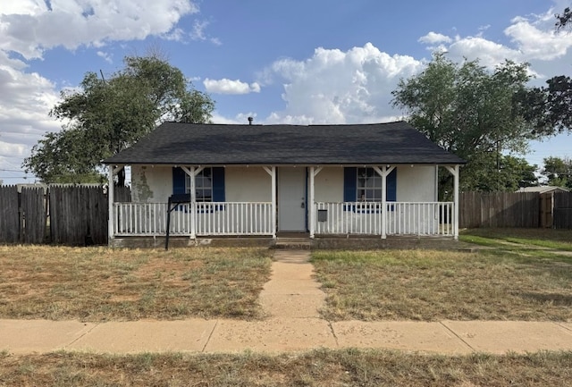 506 E Ursuline St, Lubbock, TX 79403 - view of front facade featuring a porch, roof with shingles, and stucco siding