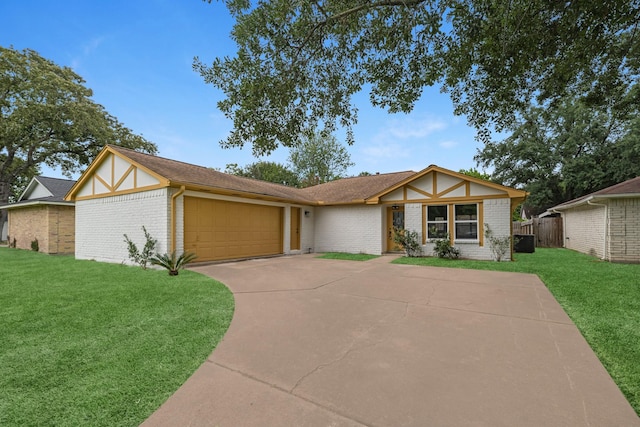 14234 Cellini Dr, Cypress, TX 77429 - english style home with a garage, brick siding, and driveway