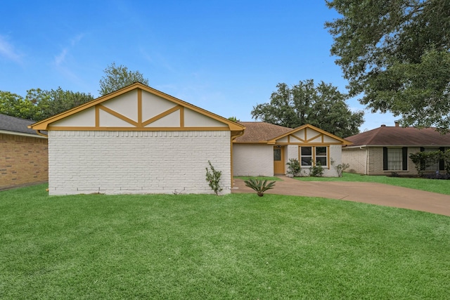 14234 Cellini Dr, Cypress, TX 77429 - view of front of house with driveway, a front yard, and brick siding
