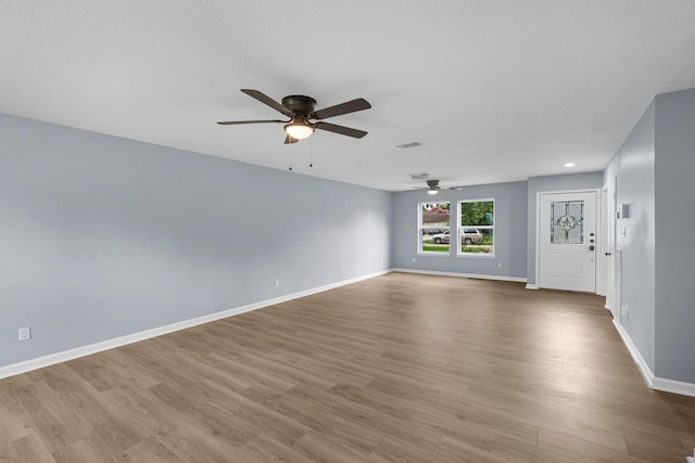 14234 Cellini Dr, Cypress, TX 77429 - empty room with a ceiling fan and wood finished floors