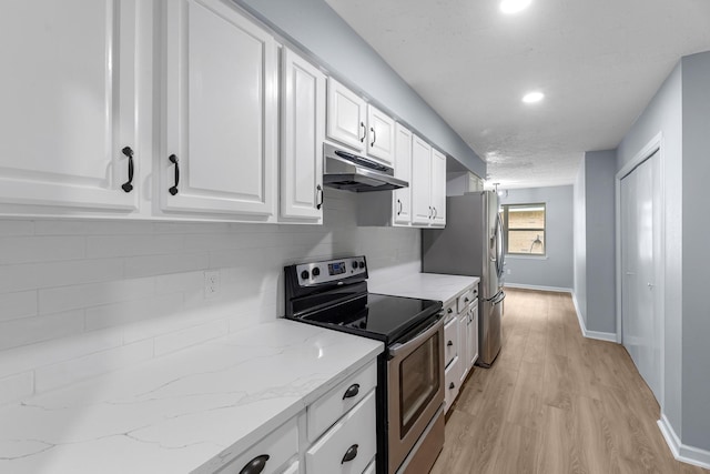 14234 Cellini Dr, Cypress, TX 77429 - kitchen featuring appliances with stainless steel finishes, under cabinet range hood, white cabinets, backsplash, and light wood-style floors