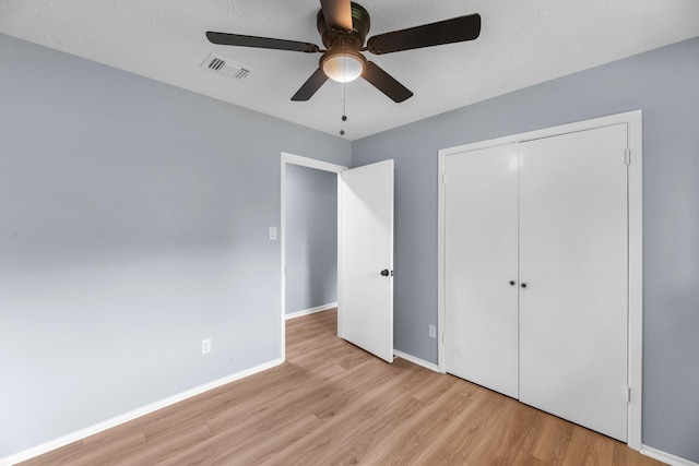 14234 Cellini Dr, Cypress, TX 77429 - unfurnished bedroom with wood finished floors, a closet, and ceiling fan
