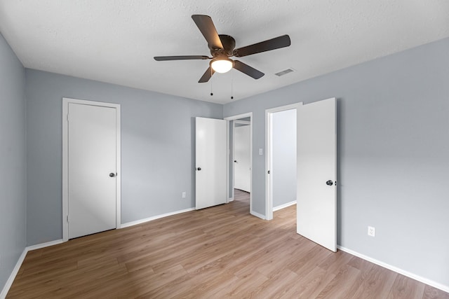 14234 Cellini Dr, Cypress, TX 77429 - unfurnished bedroom featuring wood finished floors and a ceiling fan