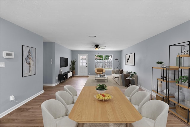 14234 Cellini Dr, Cypress, TX 77429 - dining room featuring a ceiling fan and wood finished floors