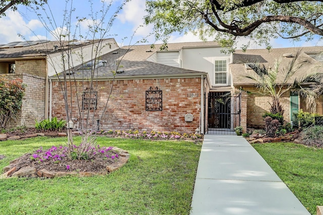 11012 Francoise Blvd, Houston, TX 77042 - view of front of home with brick siding, roof with shingles, and a gate