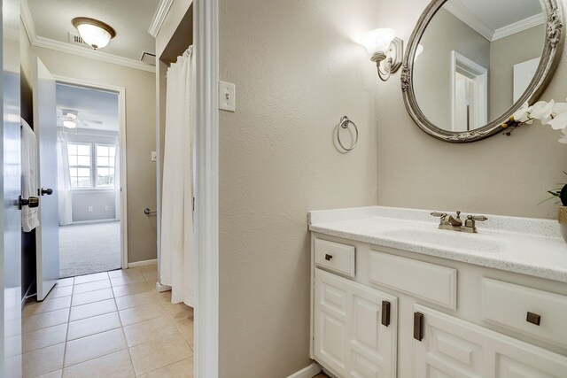 11012 Francoise Blvd, Houston, TX 77042 - bathroom with crown molding, vanity, tile patterned floors, and ceiling fan