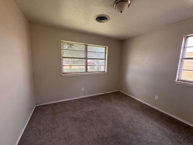 5431 45th St, Lubbock, TX 79414 - unfurnished room featuring dark colored carpet