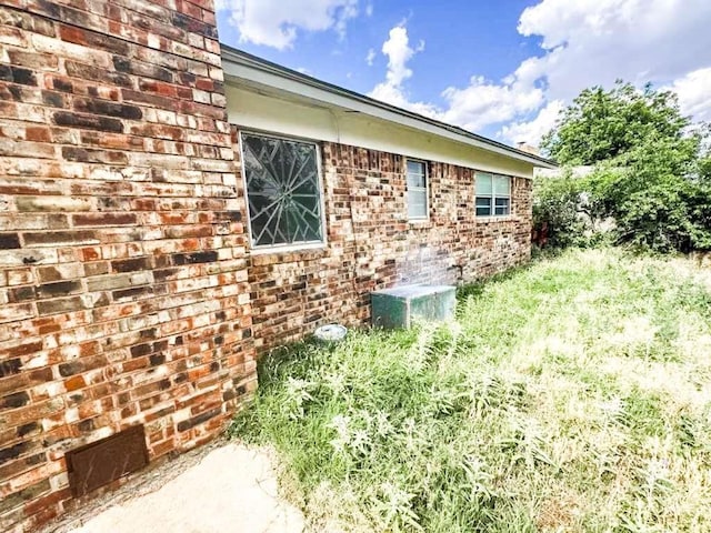 5431 45th St, Lubbock, TX 79414 - view of side of home featuring brick siding