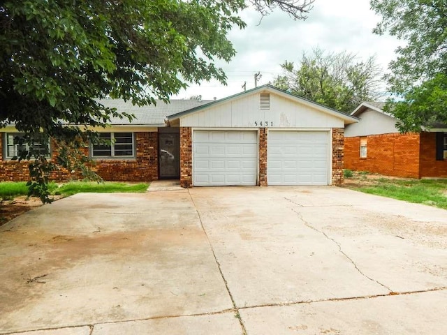 5431 45th St, Lubbock, TX 79414 - single story home featuring an attached garage, concrete driveway, and brick siding
