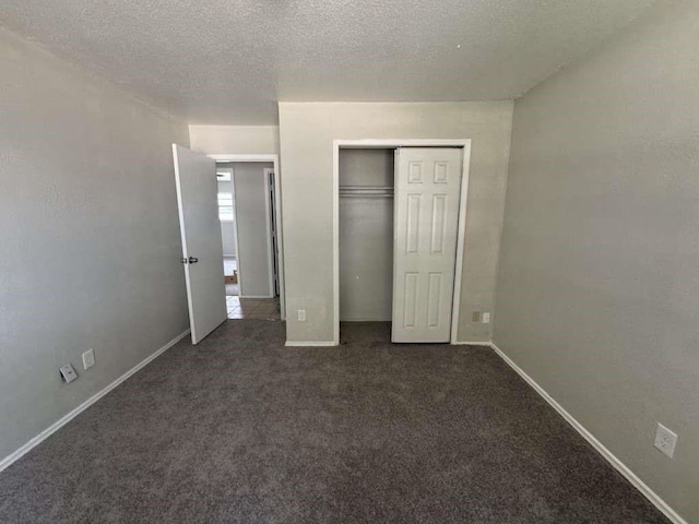 5431 45th St, Lubbock, TX 79414 - unfurnished bedroom with carpet flooring, a closet, and a textured ceiling