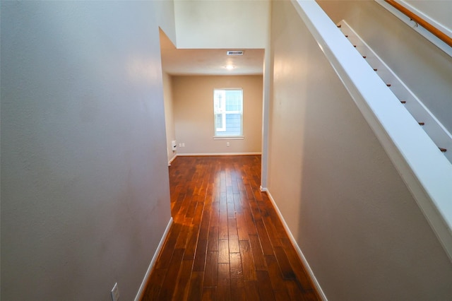 1515 Saulnier St, Houston, TX 77019 - hallway featuring dark wood-style floors and baseboards