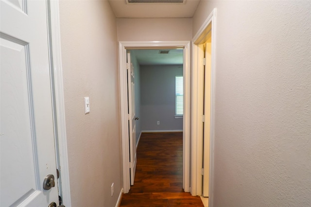 1515 Saulnier St, Houston, TX 77019 - hallway featuring dark wood-style floors and baseboards