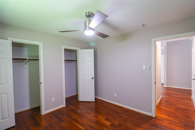 1515 Saulnier St, Houston, TX 77019 - unfurnished bedroom with multiple closets, wood finished floors, and ceiling fan