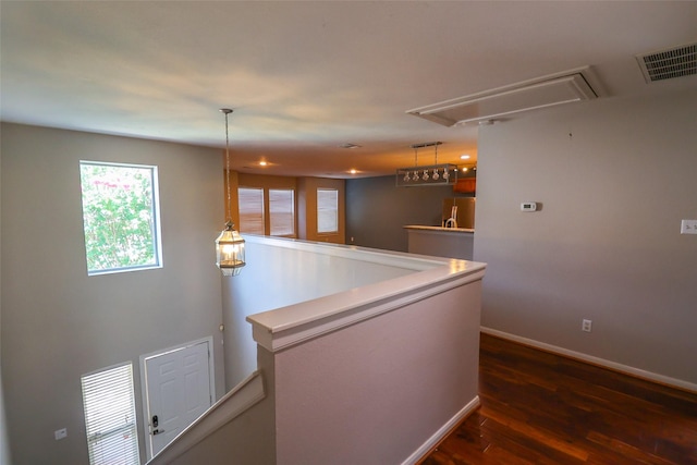 1515 Saulnier St, Houston, TX 77019 - hall featuring attic access, dark wood-type flooring, an upstairs landing, and recessed lighting