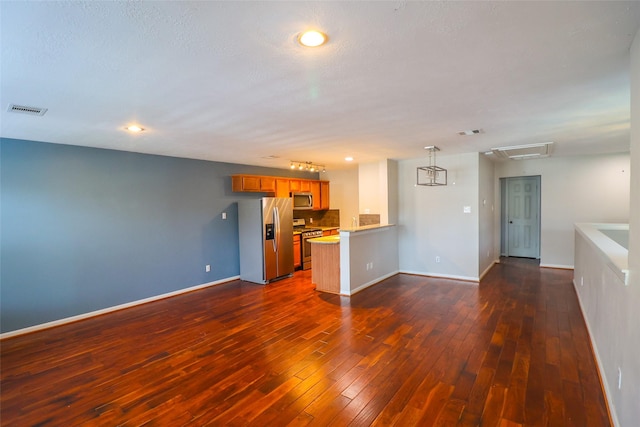 1515 Saulnier St, Houston, TX 77019 - unfurnished living room with dark wood-style flooring and recessed lighting