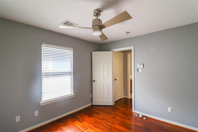 1515 Saulnier St, Houston, TX 77019 - spare room with dark wood-type flooring, a ceiling fan, and a smoke detector