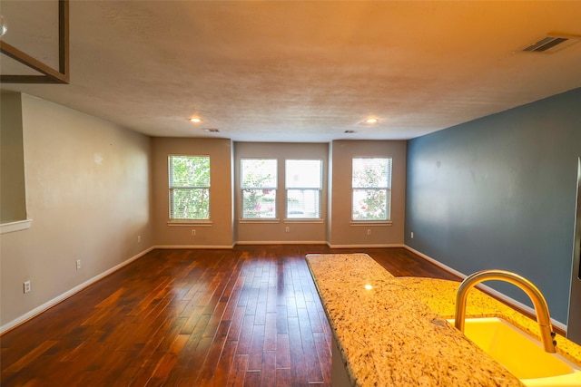 1515 Saulnier St, Houston, TX 77019 - empty room featuring dark wood-style flooring and recessed lighting