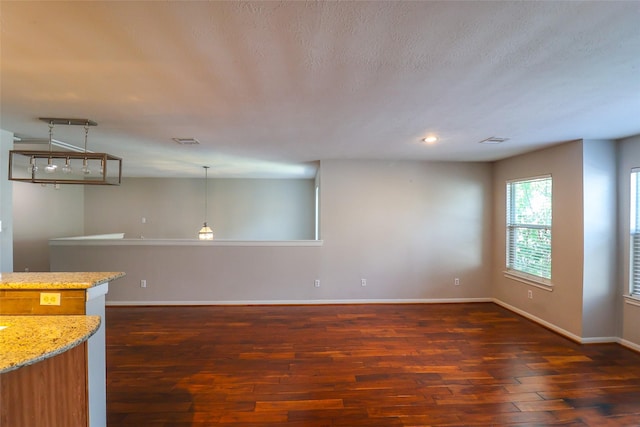 1515 Saulnier St, Houston, TX 77019 - unfurnished living room with dark wood finished floors and baseboards