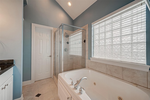 5331 Nolda St Unit A, Houston, TX 77007 - bathroom with lofted ceiling, a shower stall, a jetted tub, vanity, and tile patterned floors