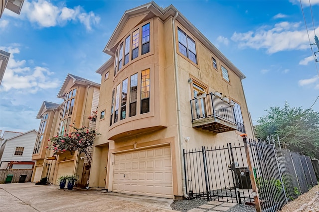 5331 Nolda St Unit A, Houston, TX 77007 - view of building exterior featuring a garage and concrete driveway
