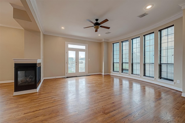 5331 Nolda St Unit A, Houston, TX 77007 - unfurnished living room featuring a ceiling fan, light wood finished floors, ornamental molding, a multi sided fireplace, and recessed lighting