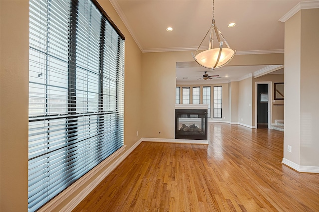 5331 Nolda St Unit A, Houston, TX 77007 - unfurnished living room with a ceiling fan, light wood finished floors, a multi sided fireplace, ornamental molding, and recessed lighting