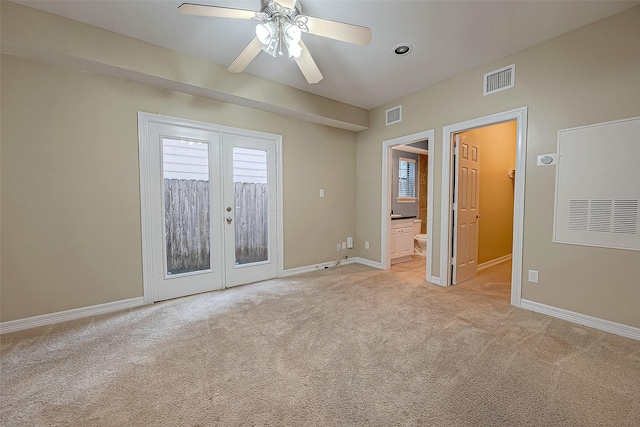 5331 Nolda St Unit A, Houston, TX 77007 - unfurnished bedroom featuring french doors, light colored carpet, access to outside, ceiling fan, and ensuite bathroom