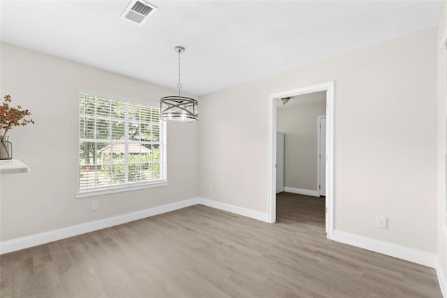 3101 Possum Trot St, Brenham, TX 77833 - unfurnished dining area with wood finished floors and a chandelier