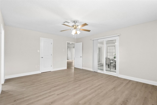 3101 Possum Trot St, Brenham, TX 77833 - empty room featuring light wood-style floors and a ceiling fan