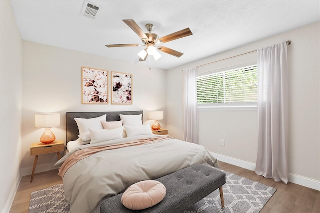 3101 Possum Trot St, Brenham, TX 77833 - bedroom with wood finished floors and ceiling fan
